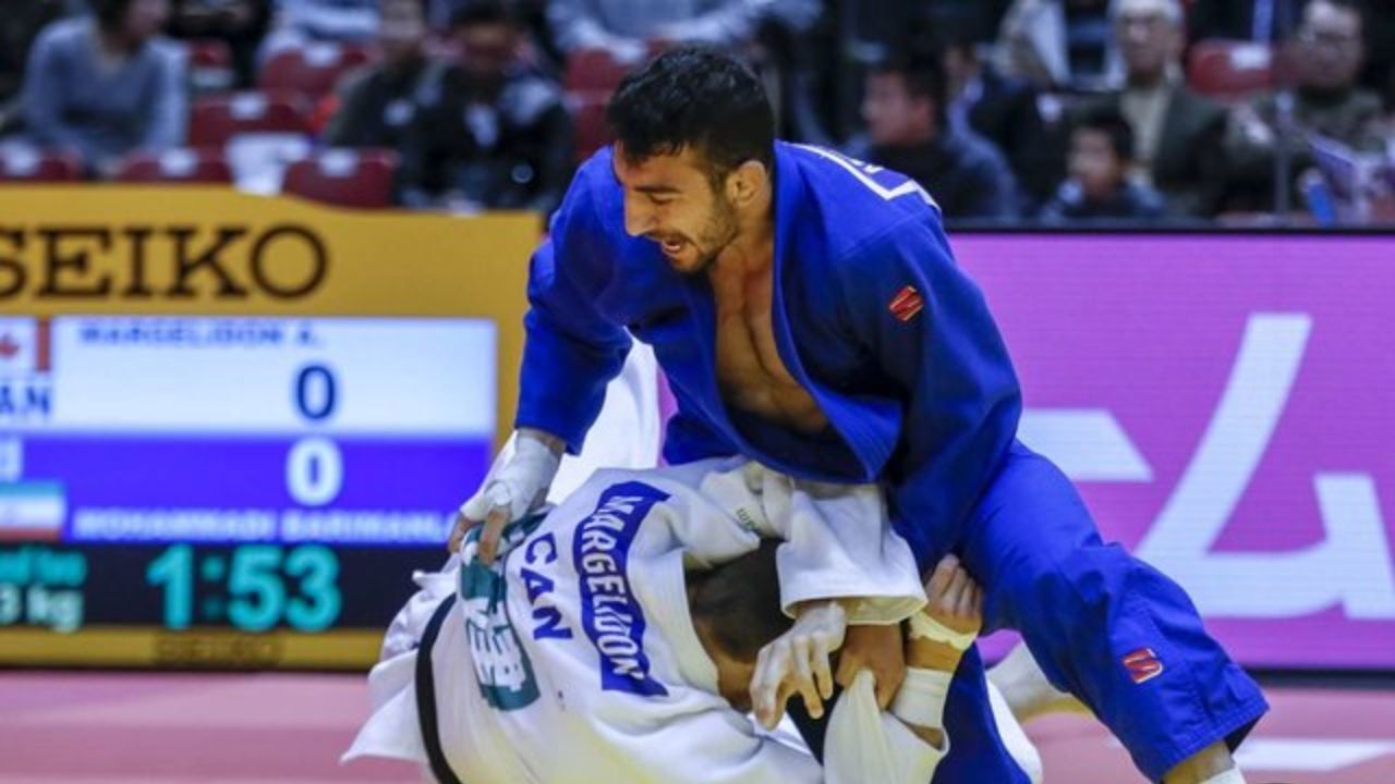 امیدوارم بتوانم با پرچم IOC به المپیک بروم
